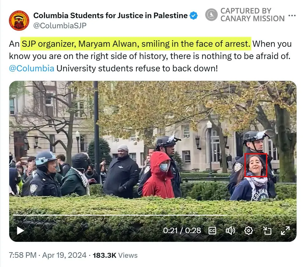 Columbia SJP praises Alwan as she smiles during her arrest at an illegal campus encampment in April 2024.